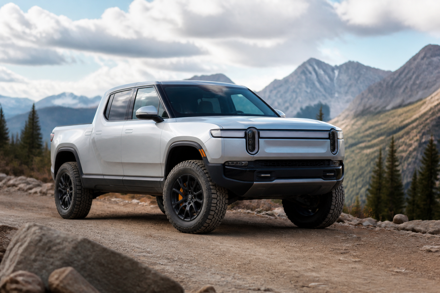 An electric pickup truck, possibly a Rivian R1T or Ford F-150 Lightning, with a visible lift kit and upgraded off-road tires, parked on a dirt road with mountains in the background, illustrating a modified EV.